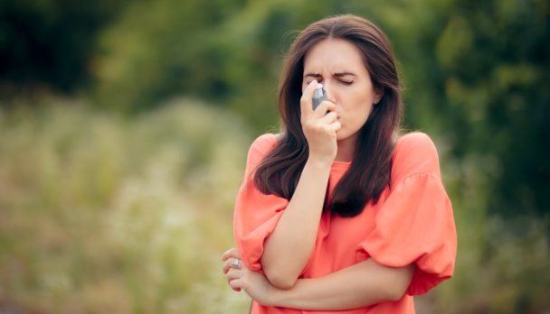 Girl,Suffering,From,Asthma,Using,Her,Inhaler,Outdoors.,Woman,With